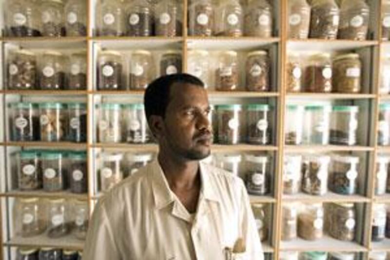 Dr Omar Hajji Mohamed in front of his jars of exotic ingredients at al Baraka Lili Ashab, the Herbal Medicine Shop, in RAK.