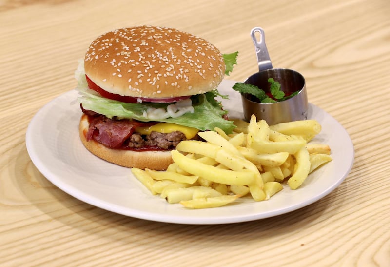 Abu Dhabi, United Arab Emirates - September 15, 2019: The IT burger. A look at the newly opened Sweet Greens café. They have a special focus on being healthy and environmentally friendly. Sunday the 15th of September 2019. Rihan Heights, Abu Dhabi. Chris Whiteoak / The National