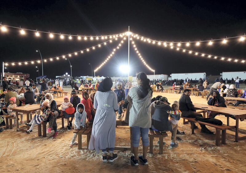 Ras Al Khaimah, United Arab Emirates - Reporter: N/A: People at the beach as Ras Al Khaimah puts on a record-breaking fireworks display on New Year's Eve. Tuesday, December 31st, 2019. Al Hamra, Ras Al Khaimah. Chris Whiteoak / The National