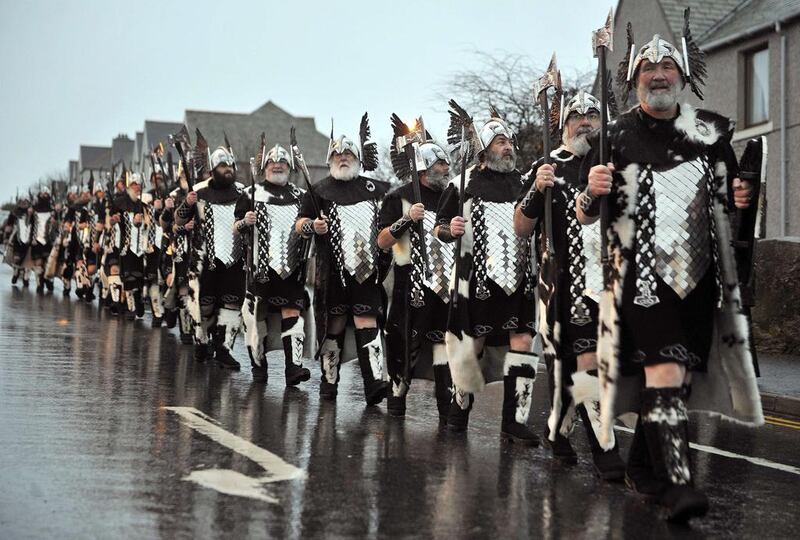  Men dressed as Vikings march through Lerwick. Andy Buchanan / AFP Photo