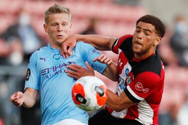 Soccer Football - Premier League - Southampton v Manchester City - St Mary's Stadium, Southampton, Britain - July 5, 2020 Manchester City's Oleksandr Zinchenko in action with Southampton's Che Adams, as play resumes behind closed doors following the outbreak of the coronavirus disease (COVID-19) Frank Augstein / Pool via REUTERS EDITORIAL USE ONLY. No use with unauthorized audio, video, data, fixture lists, club/league logos or "live" services. Online in-match use limited to 75 images, no video emulation. No use in betting, games or single club/league/player publications. Please contact your account representative for further details.