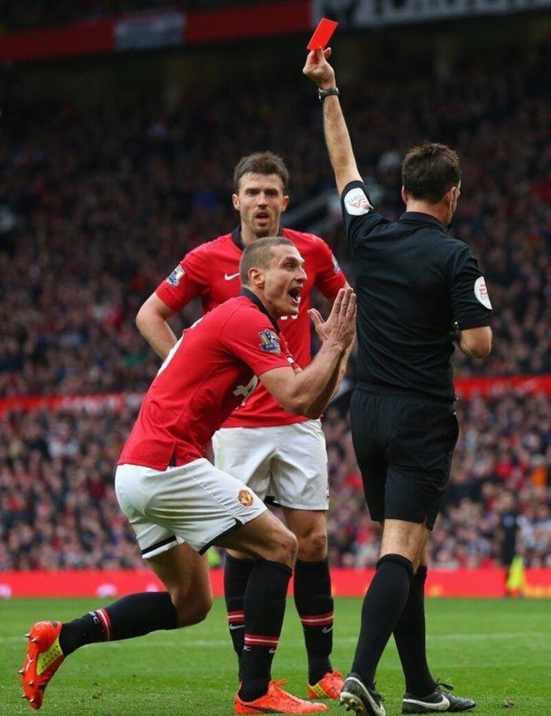 Nemanja Vidic of Manchester United is shown a red card by referee Mark Clattenburg on Sunday. Alex Livesey / Getty Images / March 16, 2014 