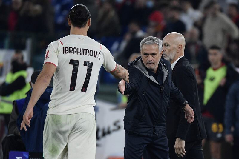 AC Milan's Zlatan Ibrahimovi and Roma coach Jose Mourinho shake hands. AFP