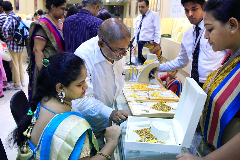 21 Oct 2014 :Mumbai - INDIA.
An Indian family sits down to buy gold jewellery at Tribhuvandas Bhimji Jhaveri at Jhaveri Bazaar on the auspicious day of 'Dhanteras' during Diwali.

(Subhash Sharma for The National)