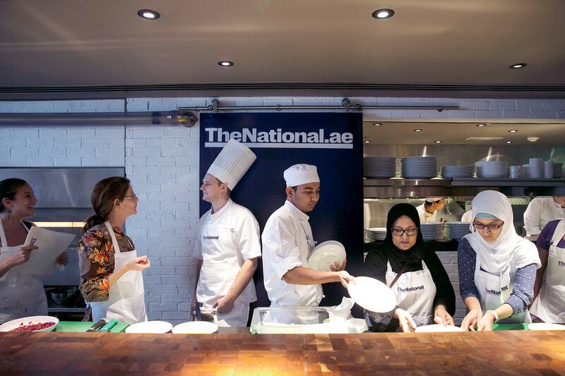 Centre left, Jordan Annabi, chef de cuisine, and, centre right, Sudhanshu Nirmal, executive sous chef, at Le Royal Méridien Abu Dhabi, make desserts at The National’s #healthyliving cooking experience. Silvia Razgova / The National