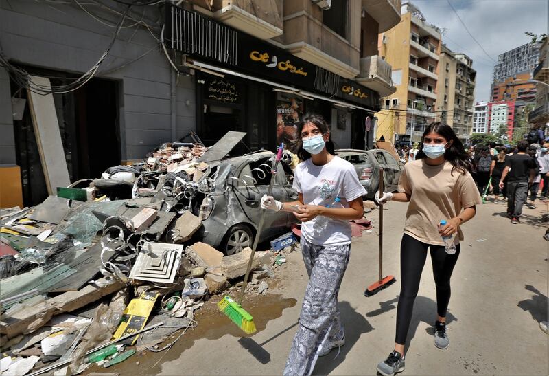 epa08588354 Volunteers remove the rubble in the damaged Al-Gemayzeh area in Beirut, Lebanon, 06 August 2020. According to the Lebanese Health Ministry, at least 137 people were killed and more than 5,000 injured in the blast believed to have been caused by an estimated 2,750 of ammonium nitrate stored in a warehouse. The explosion and its shockwave on 04 August 2020 devastated the port area and parts of the city.  EPA/NABIL MOUNZER