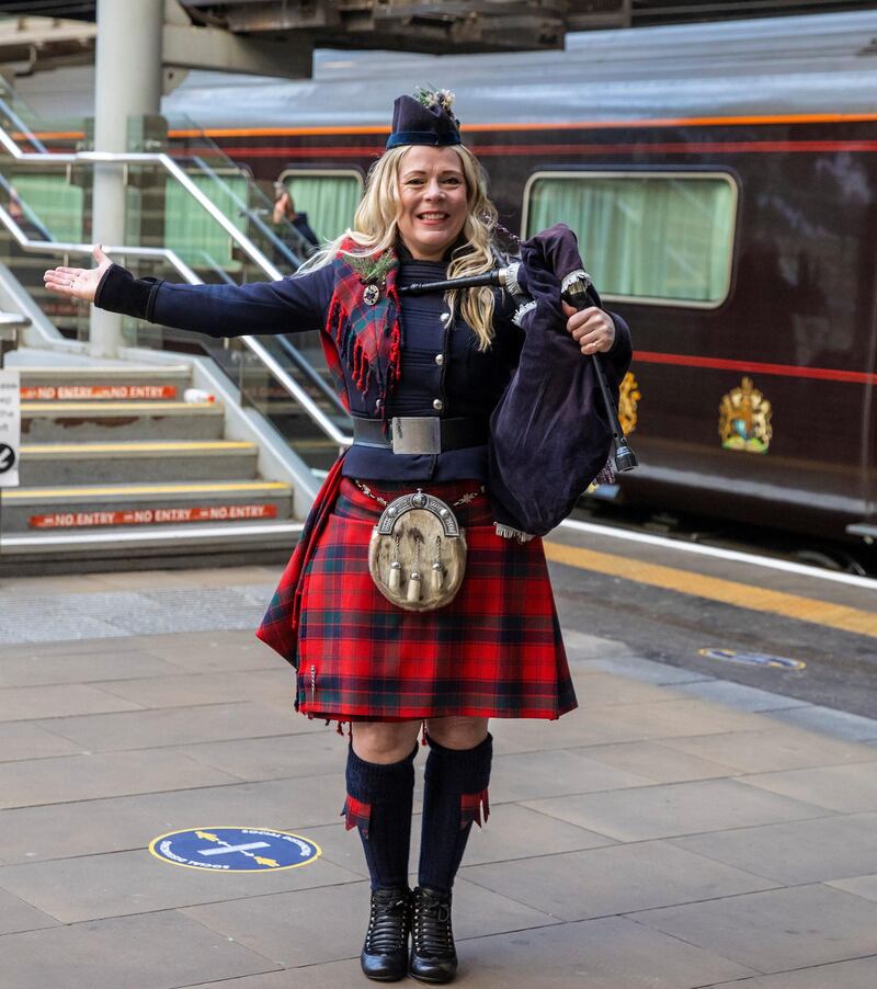 Piper Louise Marshall awaits their arrival at Edinburgh Waverley Station. Reuters