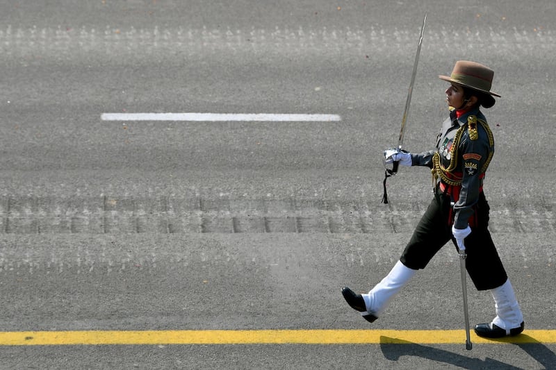 An Indian officer of the all-women Assam Rifles contingent leads for the first time their contingent during the Republic Day parade in New Delhi.  AFP