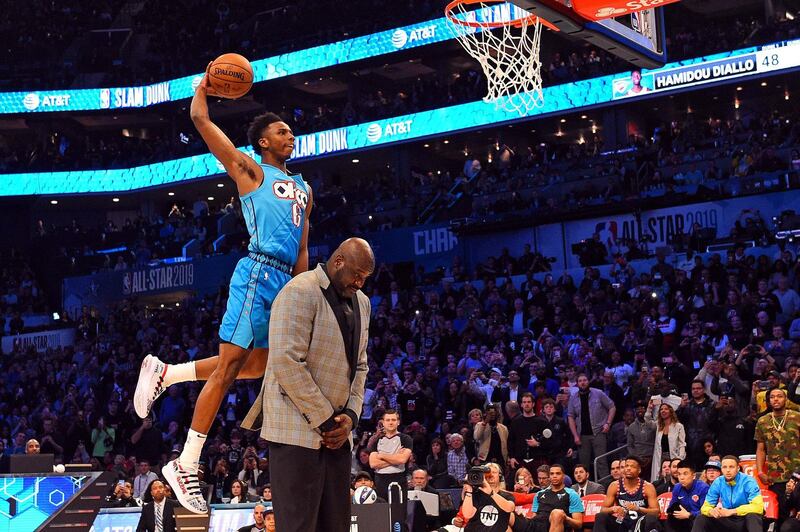Oklahoma City Thunder forward Hamidou Diallo dunks over Shaquille O'Neal in the Slam Dunk Contest during the NBA All-Star Saturday Night at Spectrum Center. Bob Donnan/USA TODAY Sports