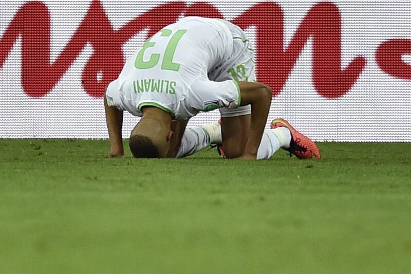 Islam Slimani shown after scoring his side's lone goal in a 1-1 draw with Russia on Thursday night at the 2014 World Cup that put them through to the last-16 of the tournament. Martin Meissner / AP / June 26, 2014