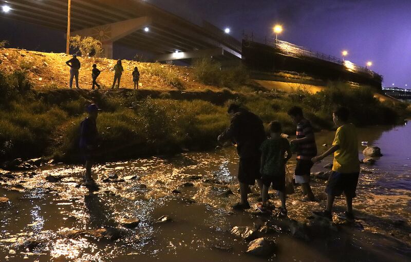 Migrants from Venezuela cross the Rio Bravo towards the US side, from Ciudad Juarez, Chihuahua state, Mexico. EPA