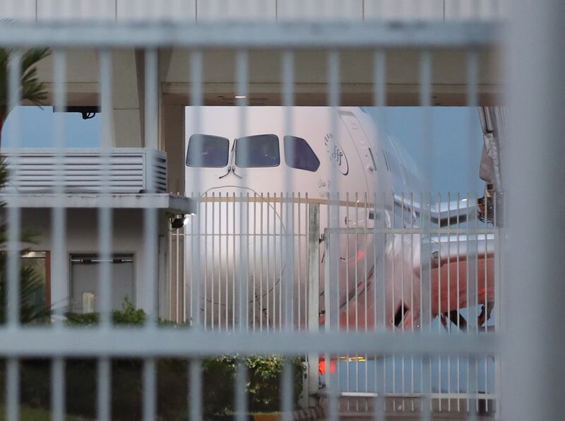 A Saudia Airlines plane believed to be carrying Mr Rajapaksa arrives on the tarmac at Changi Airport in Singapore. EPA