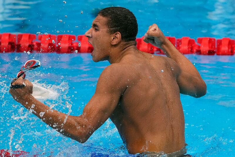 Tunisia's Ahmed Hafnaoui celebrates after winning the final of the men's 400m freestyle. AP