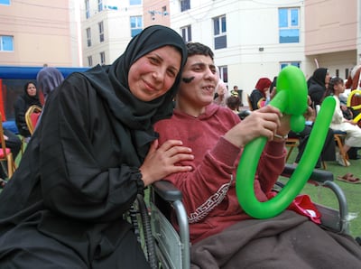 Amal Salah, left, enjoys the festivities with her sister Shrouk Salah. Victor Besa / The National