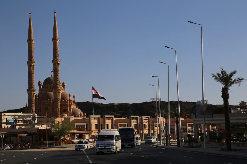 The Egyptian flag flies in the Old Market of Sharm El Sheikh ahead of the summit. 