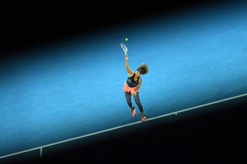 Naomi Osaka of Japan serves against Jennifer Brady. EPA