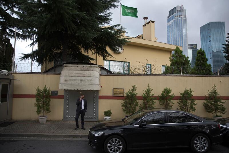 A man speaks on the phone outside the Saudi Arabia's consulate in Istanbul, Saturday, Oct. 13, 2018. Turkish officials have an audio recording of the alleged killing of journalist Jamal Khashoggi from the Apple Watch he wore when he walked into the Saudi Consulate in Istanbul over a week ago, a pro-government Turkish newspaper reported Saturday. (AP Photo/Petros Giannakouris)