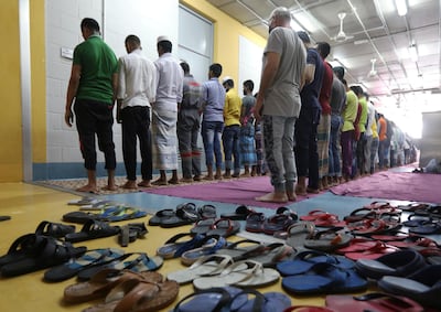 Migrant workers from Bangladesh, working for waste management company RAMCO, pray at a company facility where they also live, in Biakout, near Beirut, Lebanon, May 20, 2020. Picture taken May 20, 2020. REUTERS/Mohamed Azakir