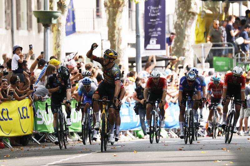 French rider Christophe Laporte of Jumbo Visma celebrates after crossing the finish line to win the 19th stage of the Tour de France 2022. EPA