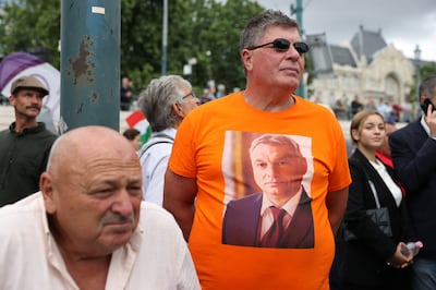 A man wears a t-shirt depicting Hungarian Prime Minister Viktor Orban as people attend a Peace March, a week ahead of elections across the European Union, in Budapest, Hungary. Reuters