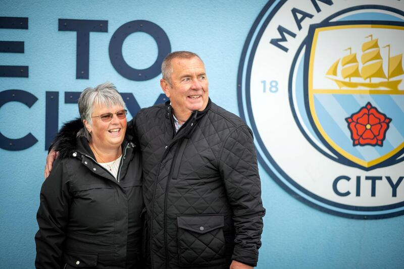 Feature on Manchester City FC at the Etihad complex and Manchester city centre.
PIC shows fans Rob Booth and Sue Booth.