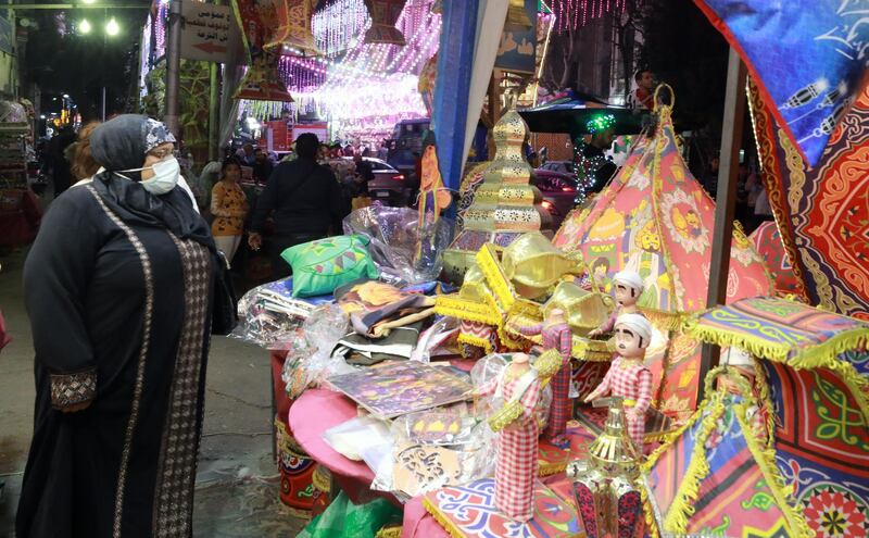 A woman browses decorative Ramadan ‘fawanees’ (lanterns) at a market in Cairo, Egypt, on April 1, 2021. EPA