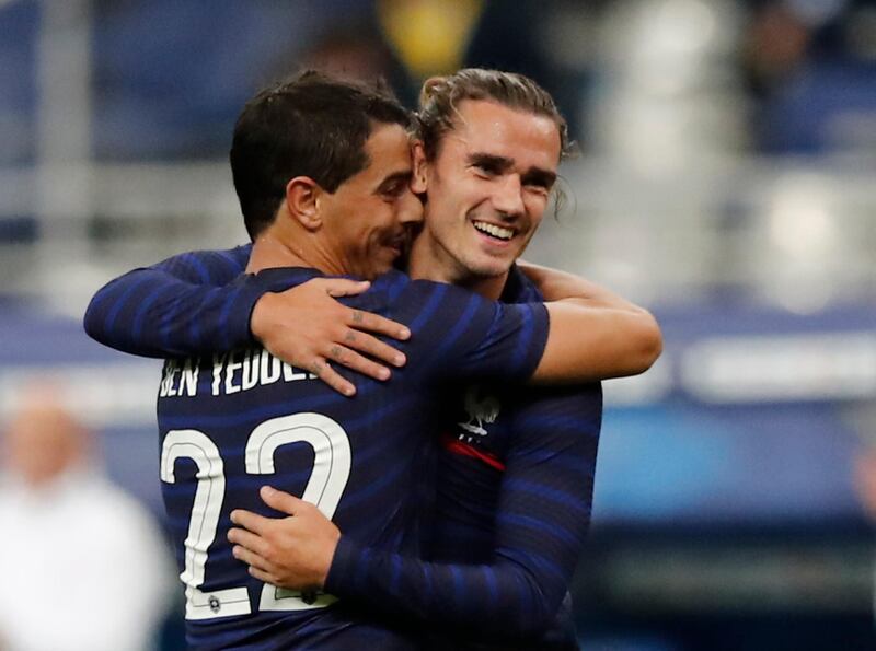 Antoine Griezmann celebrates scoring France's seventh goal with Wissam Ben Yedder. Reuters