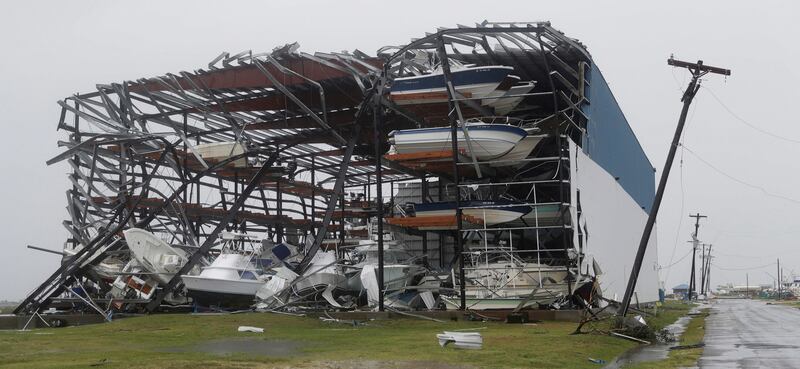 Toppled boats hang in the debris of a boat storage facility that was damaged by Hurricane Harvey in Rockport, Texas. Eric Gay / AP Photo