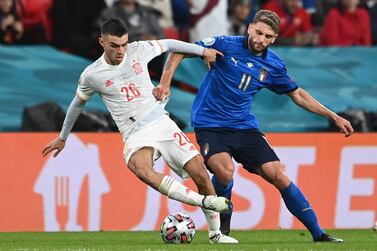 Italy's forward Domenico Berardi (R) vies for the ball with Spain's forward Pedri during the UEFA EURO 2020 semi-final football match between Italy and Spain at Wembley Stadium in London on July 6, 2021.  (Photo by Andy Rain  /  POOL  /  AFP)