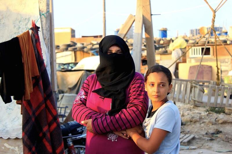  Syrian refugee Fatima and her elder daughter in 2012. Preethi Nallu for The National