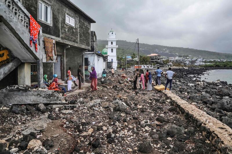 Residents gather their belongings on April 27, 2019 in Fumbuni, 56km south of Comoros capital Moroni, following the passage of the Cyclone Kenneth. Thousands of people in remote areas of storm-lashed Mozambique were homeless Saturday and bracing for imminent flooding, food and water shortages as Cyclone Kenneth flattened entire villages, leaving rescuers struggling to reach them. AFP