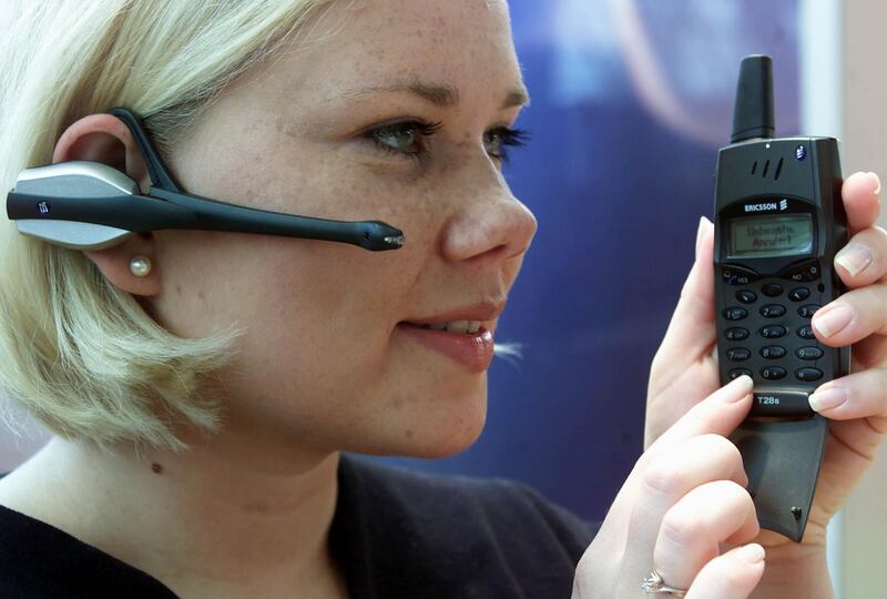 A model uses Swedish communication giant Ericsson's wireless headset for mobile phones prior to its launch at the world's biggest computer fair "CeBIT 2000" in Hanover February 23. The CeBIT opens to the public tomorrow runs until March 1.