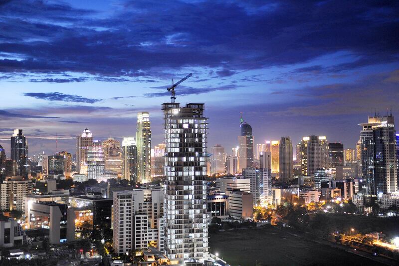 In this photograph taken on January 27, 2013, the Jakarta skyline is seen at dusk. Indonesia is expected to grow 6.3 percent in 2013 after expanding this year by 6.1 percent, the World Bank said in their December 18, 2013 report.  AFP PHOTO / ROMEO GACAD