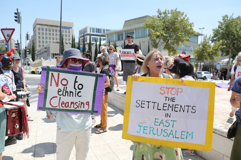 Israeli left-wing activists protest outside the Supreme Court in Jerusalem against government policy regarding Palestinians in East Jerusalem. The Israeli Supreme Court was discussing the eviction of Palestinian families from their homes in Sheikh Jarrah.