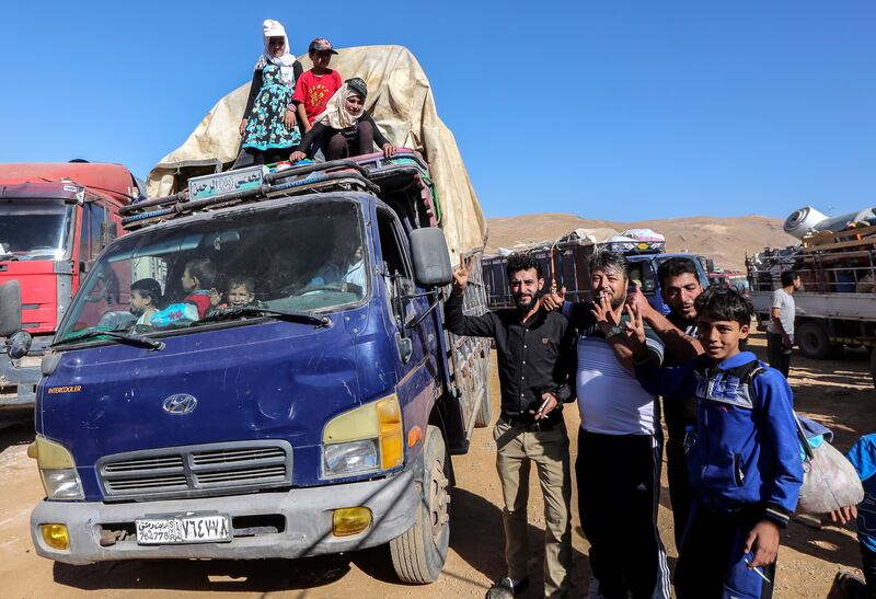 epa06906443 Syrian refugees sit inside their cars waiting to be evacuated from their refugee camps in the village of Arsal, east of Lebanon, 23 July 2018, to return home to their villages in al-Qalamoun area in the western Damascus countryside. According to media reports, Lebanon hosts 1,011,366 Syrian refugees registered with UNHCR, Including 80 thousand refugees living in seven camps in the city of Arsal. 850 person who have permission from the Syrian authority left to return home on 23 July 2018, where tousends of Syrian refugees families registers their names and wait the syrian permission.  EPA/NABIL MOUNZER