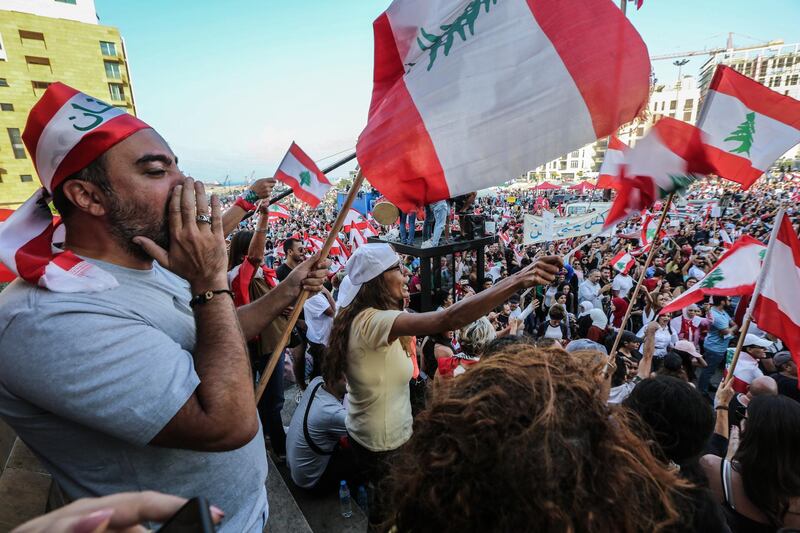 Protesters attend a demonstration against government in front of Muhammad al-Amin Mosque in downtown Beirut, Lebanon. EPA