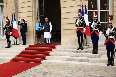 The French Prime Minister shakes hands with her Indian counterpart before their talks in Paris. AP