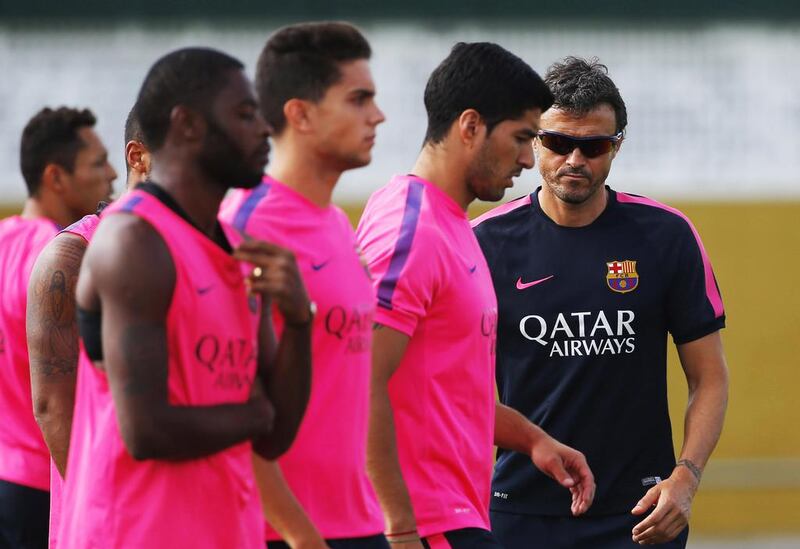 Luis Enrique, right, says Barcelona have the desire after ending last season trophy-less. Emilio Morenatti / AP Photo