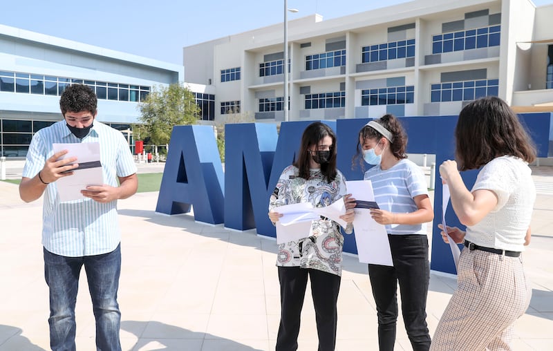 Pupils Kareem Baloawi, 16, Rahaf Teggaz, 16, Maram Chetioui, 15, and Fransio Van Ravenswaay, 16, receive their GCSE results after a long summer of anticipation at Amity International School Abu Dhabi