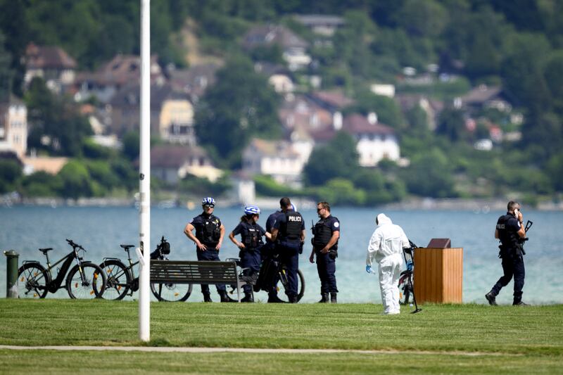 French police gather on the shore of Annecy Lake. EPA