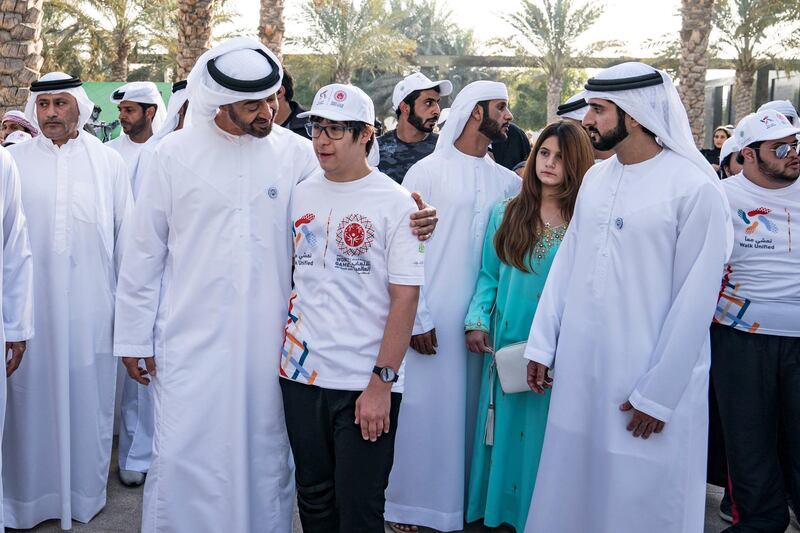 ABU DHABI, UNITED ARAB EMIRATES - January 26, 2018: HH Sheikh Mohamed bin Zayed Al Nahyan, Crown Prince of Abu Dhabi and Deputy Supreme Commander of the UAE Armed Forces (3rd L), speaks with a participant during the Special Olympics Wold Games Abu Dhabi 2019 initiative "Walk Unified", at Umm Al Emarat Park. Seen with HH Sheikh Hamdan bin Mohamed Al Maktoum, Crown Prince of Dubai (R), and HH Sheikha Al Jalila bint Mohamed bin Rashid Al Maktoum (2nd R).

( Hamad Al Kaabi / Crown Prince Court - Abu Dhabi )
—