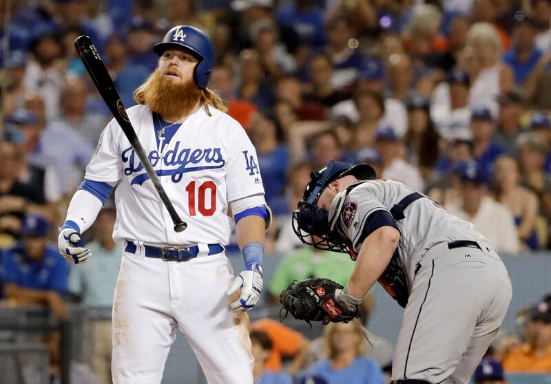 Los Angeles Dodgers' Justin Turner reacts after striking out against the Houston Astros during the eighth inning of Game 1 of baseball's World Series Tuesday, Oct. 24, 2017, in Los Angeles. (AP Photo/Matt Slocum)