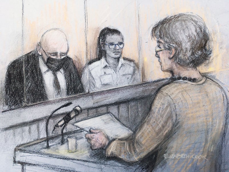 This court sketch shows Susan Everard, right, the mother of Sarah Everard, reading a victim impact statement as former Metropolitan Police officer Wayne Couzens, left, sits in the dock at the Old Bailey in London.  AP Photo
