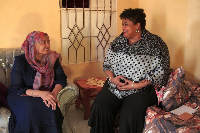 Salma Amin Israil, great-granddaughter of an Iraqi Jew who settled in Sudan and whose family later converted to Islam, and Yosar Basha, another Sudanese woman descended of Jewish origins, chat at Ms Israil's home. AFP