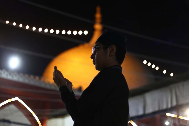 A boy prays during Ramadan in Karachi, Pakistan. EPA