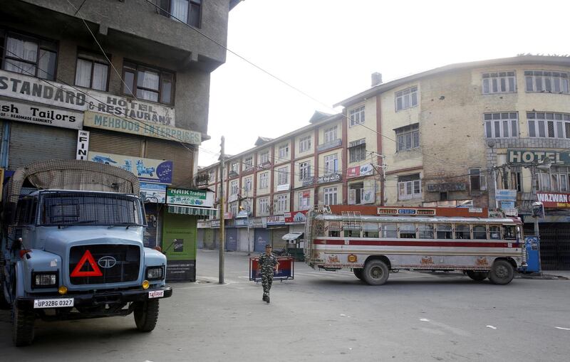 Indian paramilitary soldiers patrol on a street in Srinagar, the summer capital of Indian Kashmir.  EPA