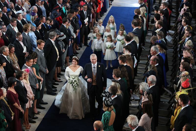 Princess Eugenie walks down the aisle with her father, Prince Andrew for her wedding to Jack Brooksbank at St George's Chapel in Windsor Castle in October 2018.