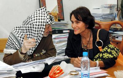 In this handout picture released by the Palestinian Authority's press office (PPO), Palestinian leader Yasser Arafat talks to Spanish Princess Maria Teresa of Bourbon during their meeting at his office in the West Bank city of Ramallah 25 August 2004. The cousin of Spain's King Juan Carlos is on a private visit to the Palestinian territories. AFP PHOTO/HO/PPO (Photo by HUSSEIN HUSSEIN / PPO / AFP)
