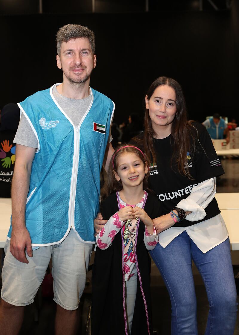 Volunteer Wissam Ghaib with his wife Hana and daughter Iman at the Gaza aid event in Dubai