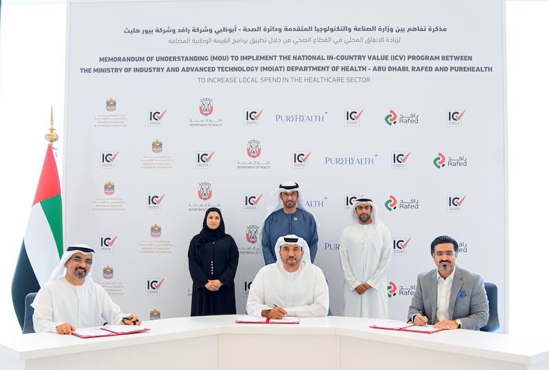 Dr Sultan Al Jaber, Minister of Industry and Advanced Technology (back centre) and Sarah Al Amiri, Minister of State for Public Education and Advanced Technology (back left) attend the signing of the agreement. Photo: MoIAT